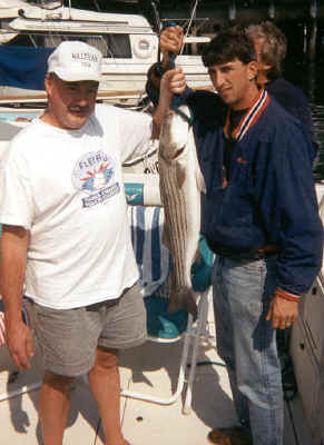 wo happy fishermen with a catch from Many Waters